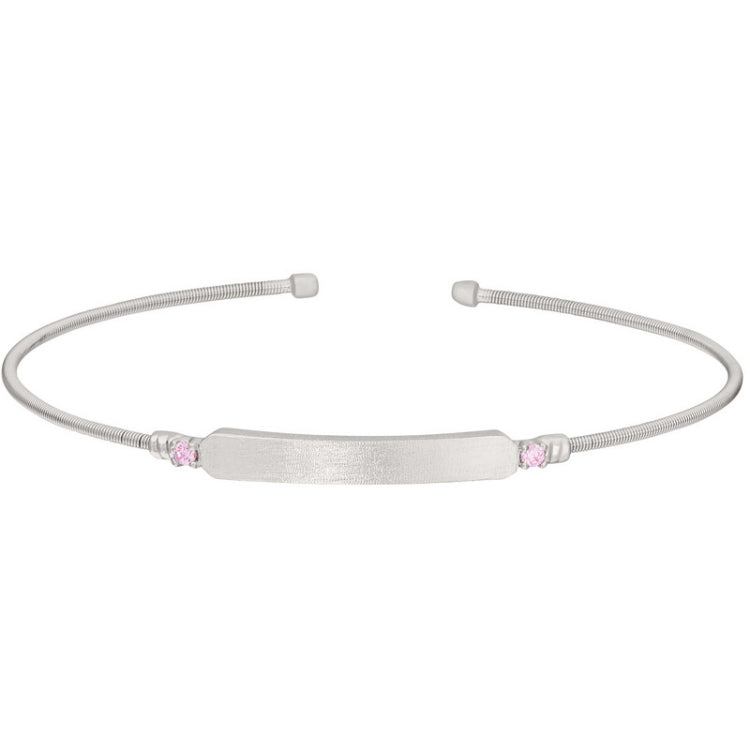 Rhodium finish sterling silver cable cuff bracelet with name plate and simulated pink sapphire birth gems - october
