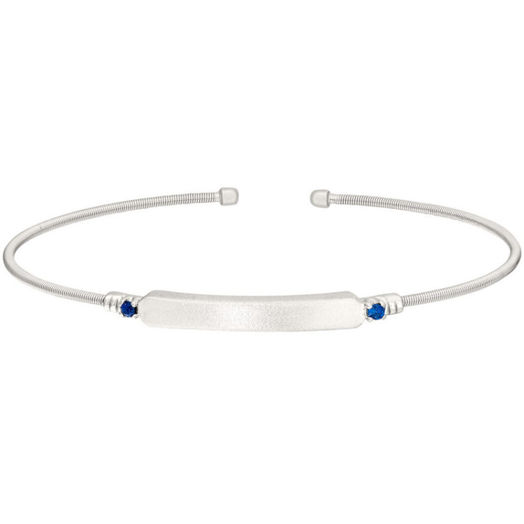 Rhodium finish sterling silver cable cuff bracelet with name plate and simulated blue sapphire birth gems - september