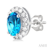 5x3 MM Oval Shape Blue Topaz and 1/8 Ctw Round Cut Diamond Halo Semi-Precious Stud Earrings in 14K White Gold