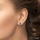 5x3 MM Oval Shape Garnet and 1/8 Ctw Round Cut Diamond Halo Semi-Precious Stud Earrings in 10K White Gold