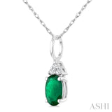 1/50 Ctw Oval Cut 6X4 MM Emerald and Round Cut Diamond Precious Pendant With Chain in 10K White Gold