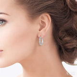 1/10 ctw Round Cut Diamond Infinity Earrings in Sterling Silver
