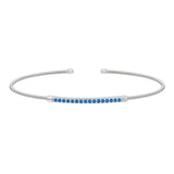 Rhodium finish sterling silver cable cuff bracelet with simulated blue zircon birth gems - december